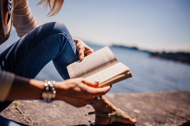 A girl reading a book.