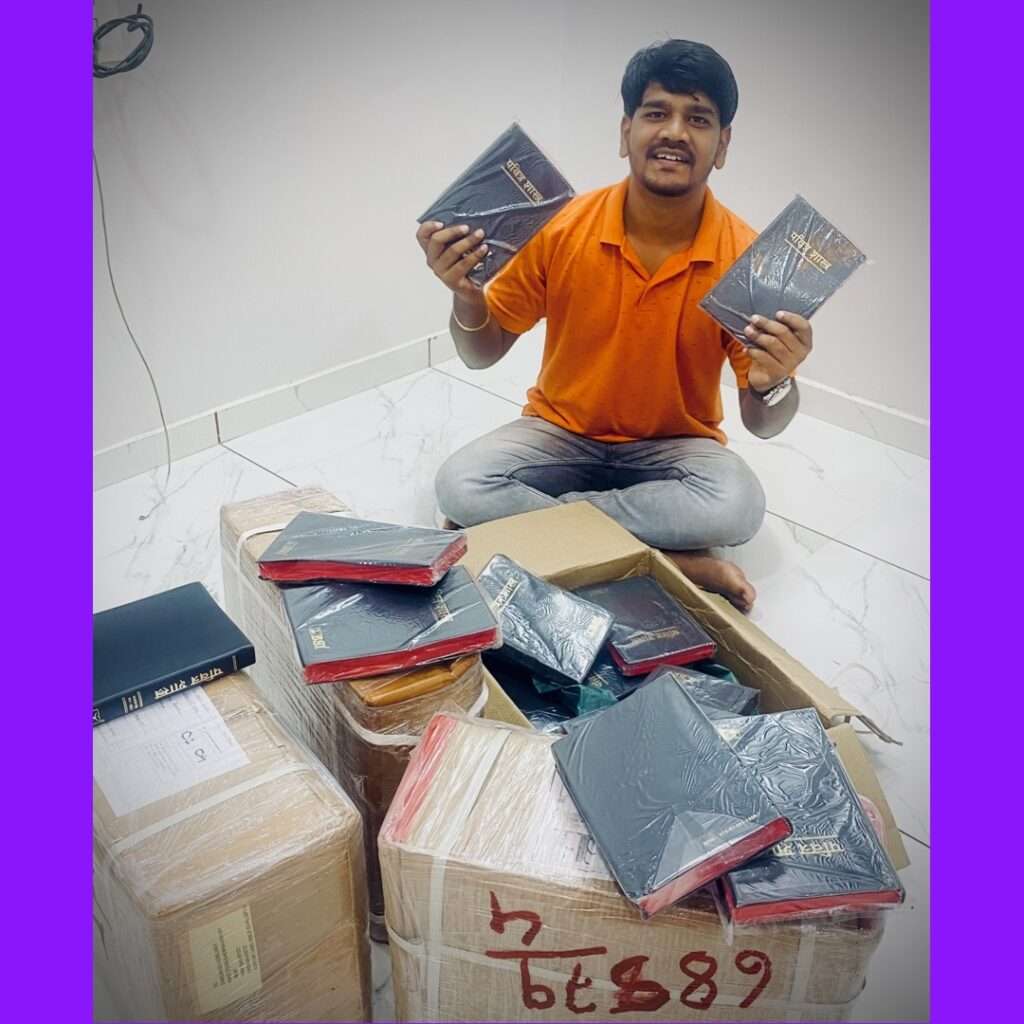 Evangelist Rohit Londhe with the Bibles.